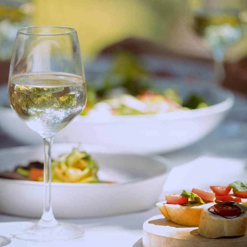 close-up-of-food-and-wine-glass-on-dining-table