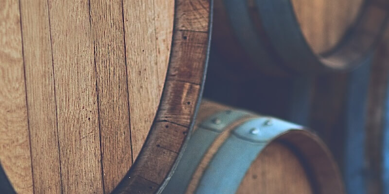 wine-barrels-stacked-in-the-old-cellar-of-the-wine